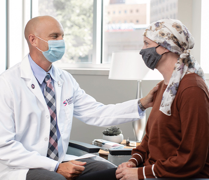 A doctor seeing a cancer patient