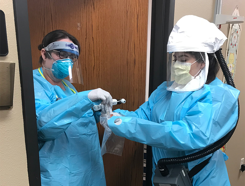 Nurses wearing PPE in clinic