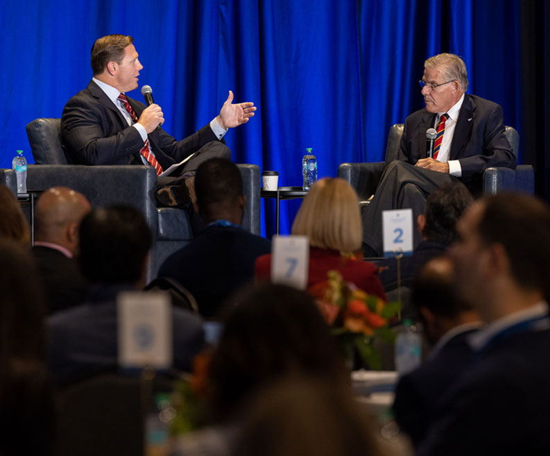 Sanford Health President and CEO Bill Gassen (left) moderates a conversation with AHA President and CEO Rick Pollack at the Summit on the Future of Rural Health Care, Oct. 14, 2025.
